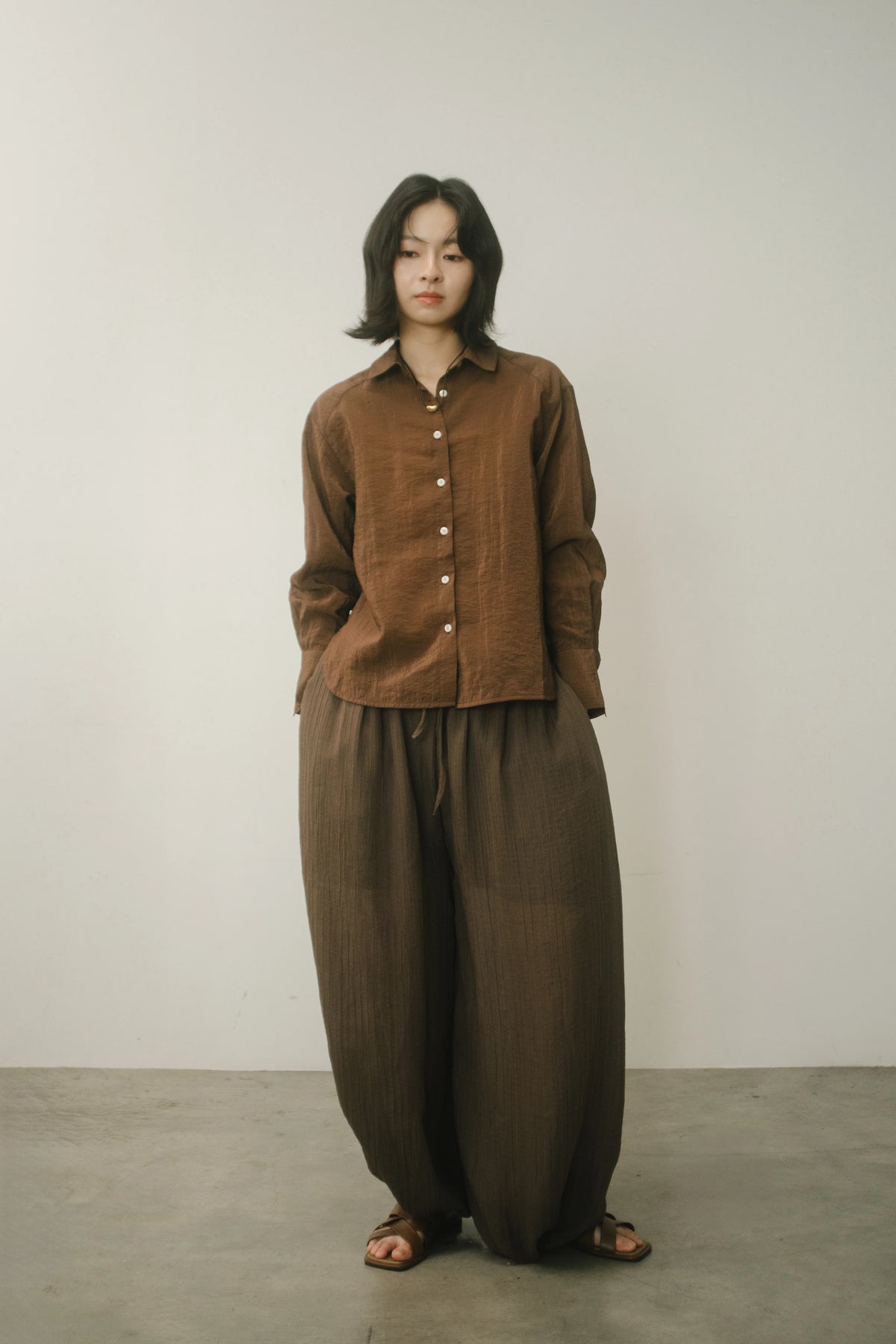 WES x GUNG x SO | Easy Shimmer U-Hem Blouse (Brown)