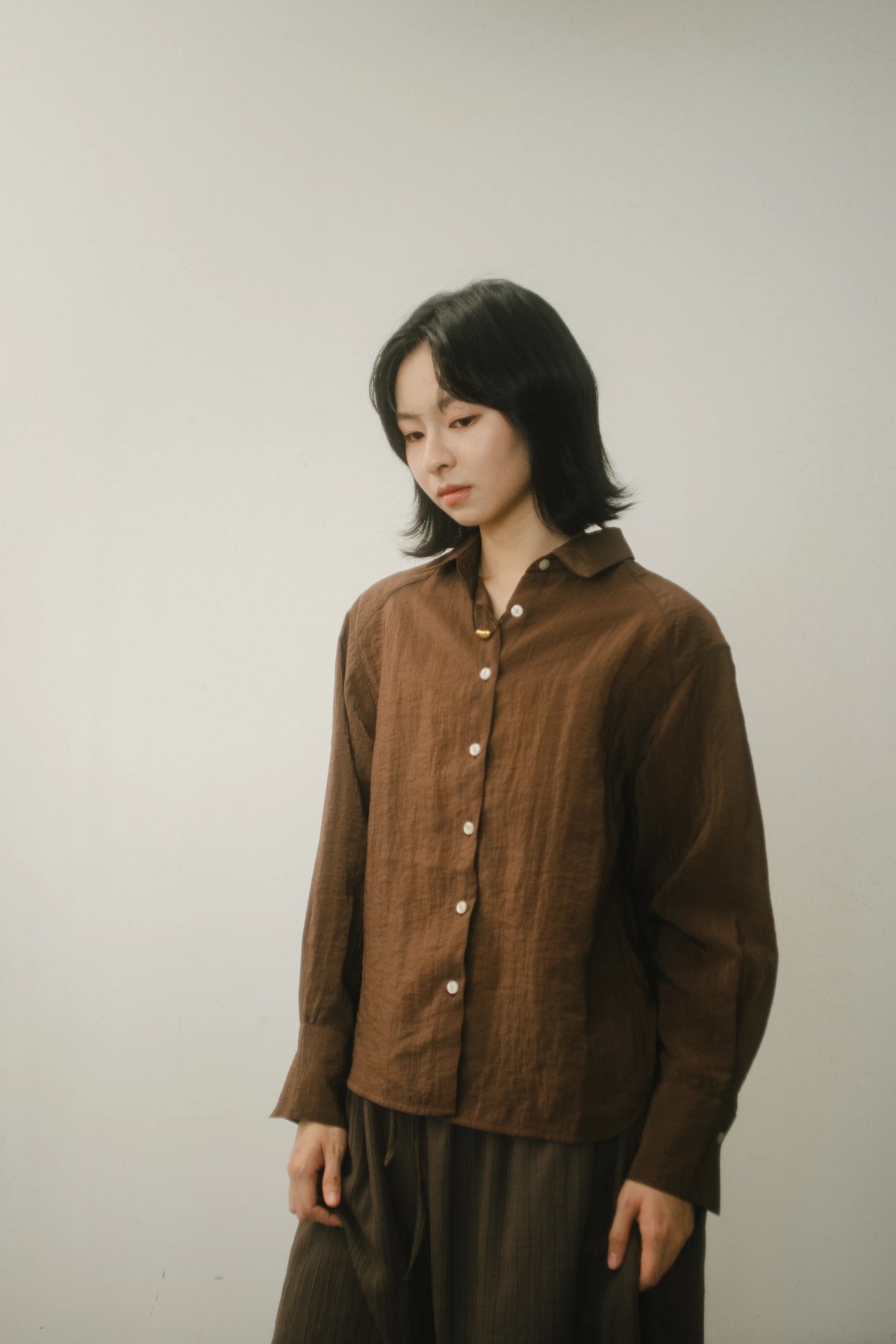 WES x GUNG x SO | Easy Shimmer U-Hem Blouse (Brown)
